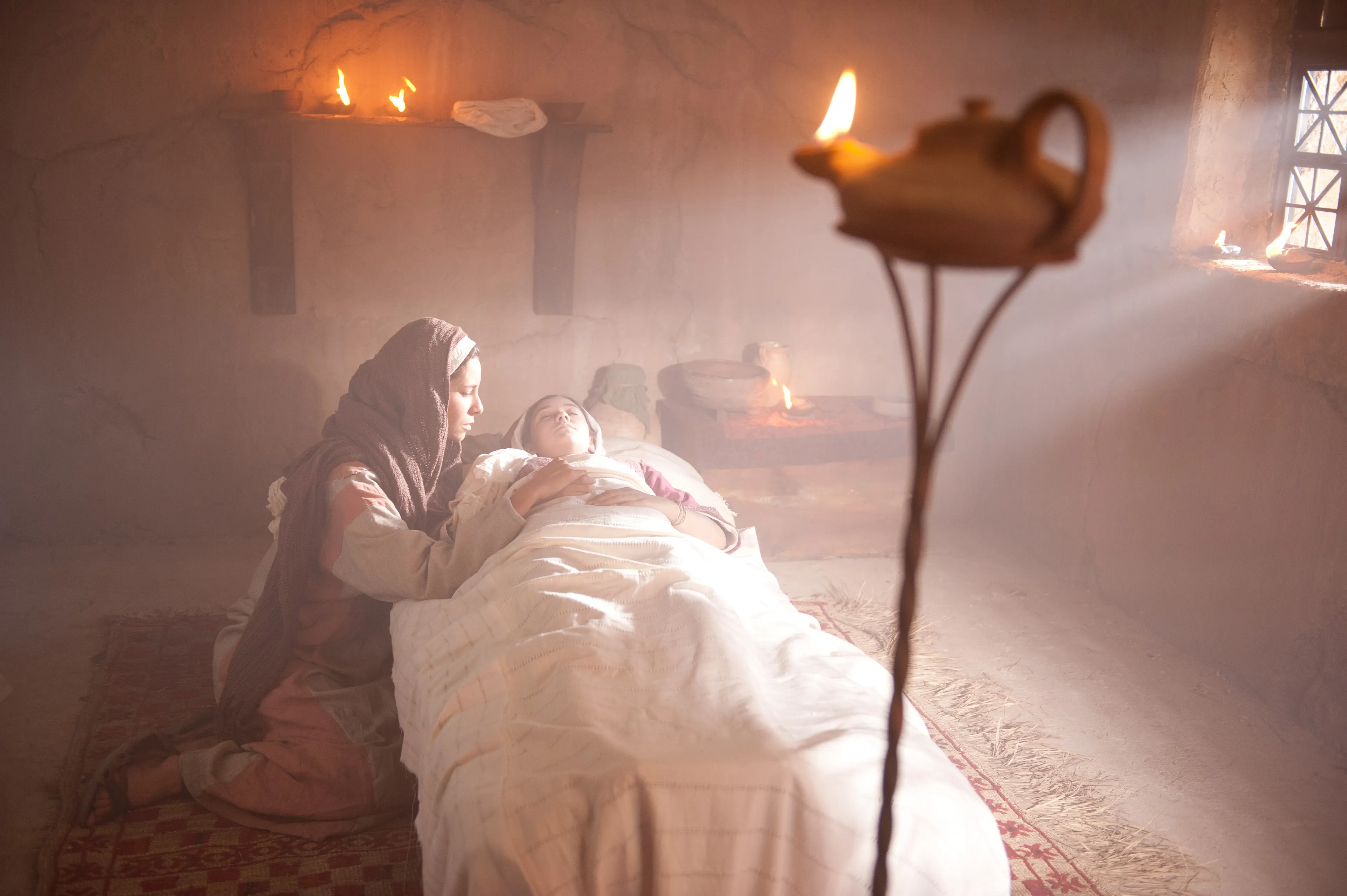 The daughter of Jairus lays as if she were dead.