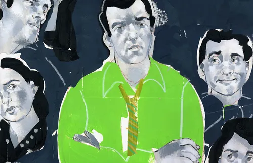 man with arms folded; other people looking on