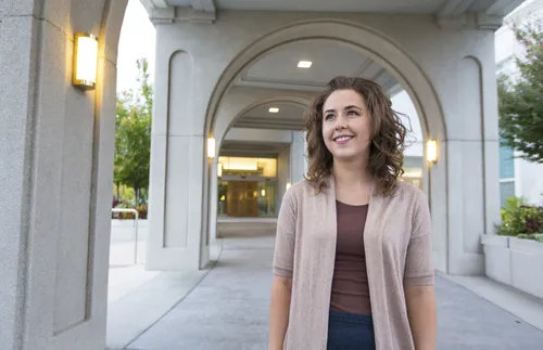 young woman in front of temple