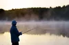 man fishing at lake