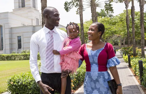 family walking by Ghana Temple