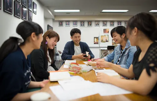 five students sitting at a table at institute