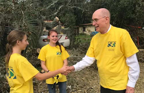 Young women with President Eyring