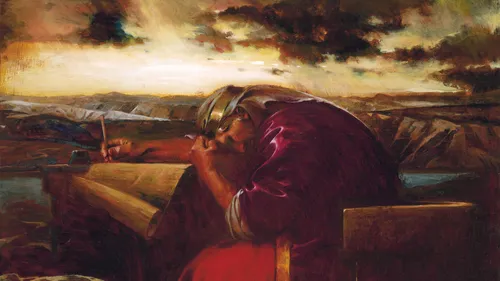 David sitting in a chair and bowing his head