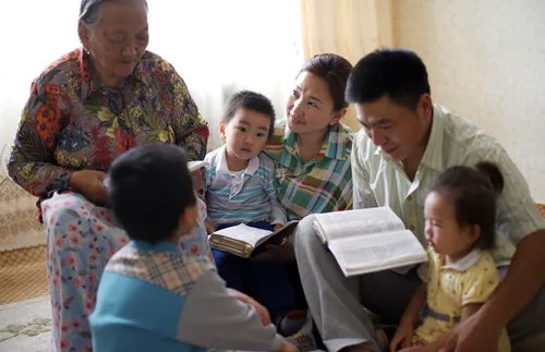 family reading the scriptures