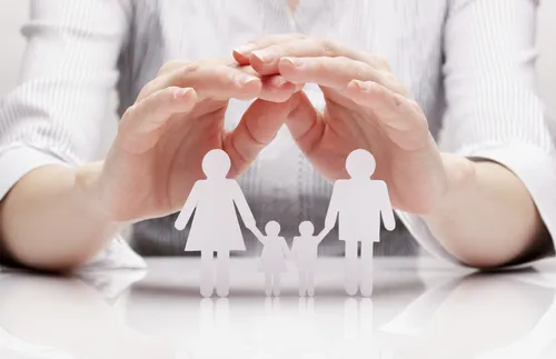 paper doll family with hands hovering