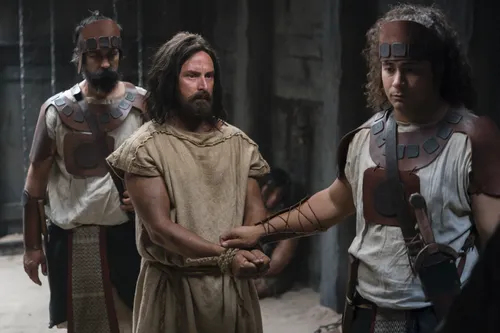 Abinadi is dragged from prison by King Noah's guards.