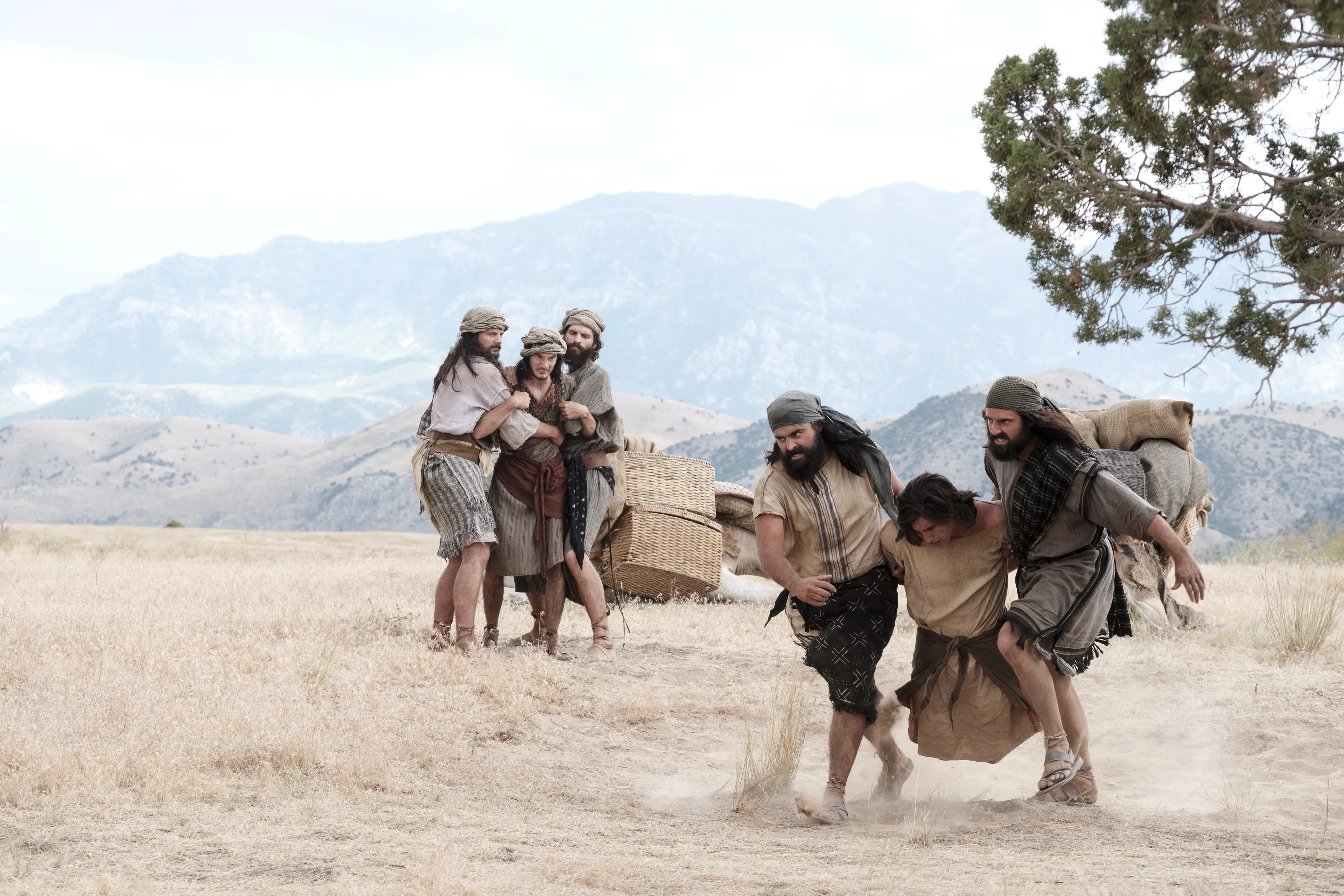 Laman and Lemuel bind and carry Nephi.