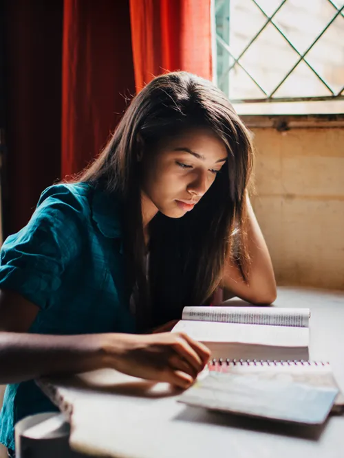young woman studying scriptures