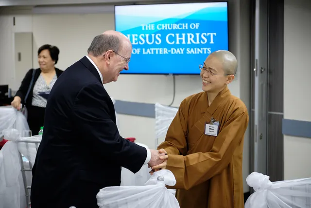 Elder Quentin L. Cook of the Quorum of the Twelve Apostles greets Venerable Miao Jing Shih, head abbess of the Fo Guang Shan Mabuhay Temple, during an interfaith gathering at the Philippines Area Office on Monday, January 13, 2020.