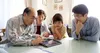 family looking at tablet computer