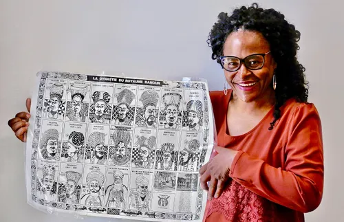 Abigahel Kinic holdidng up chart with family history information