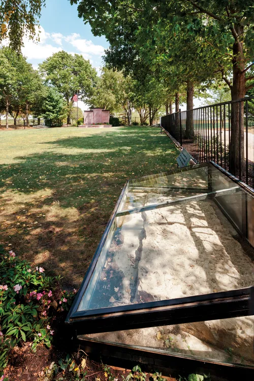 A cornerstone sits on the ground at the Far West temple site.