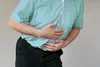 person holding abdomen