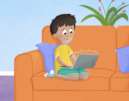 Boy looking at a laptop computer