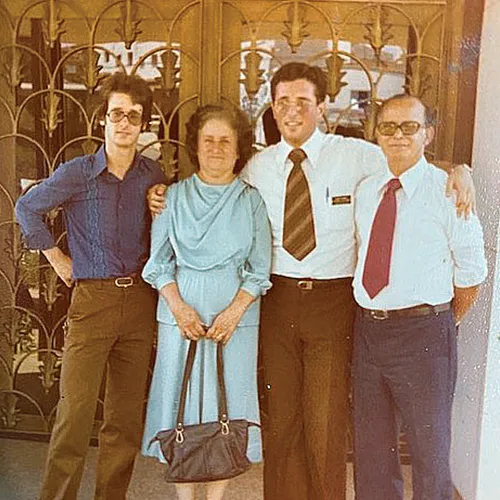 Elder Soares as a young missionary, with his brother and parents