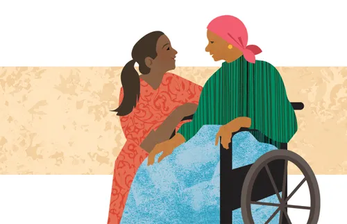 a woman comforts another woman in a wheelchair