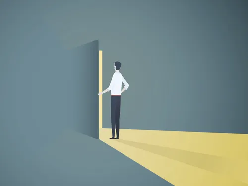 man standing before open door