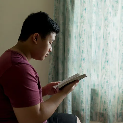 young man reading the scriptures