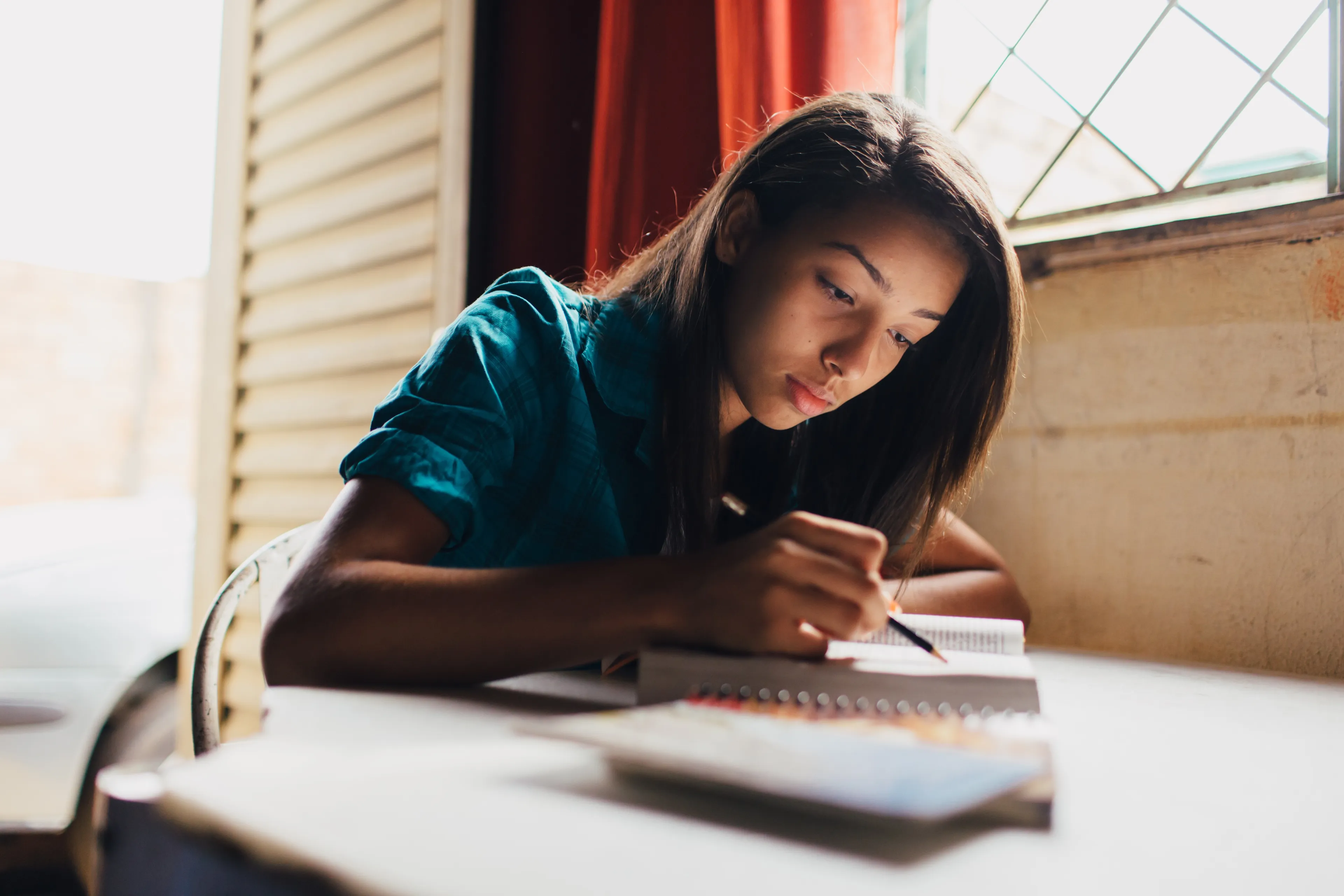 A young woman studying scriptures in Brazil.