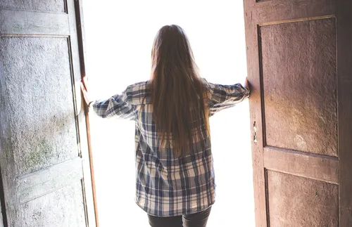 Woman opening doors