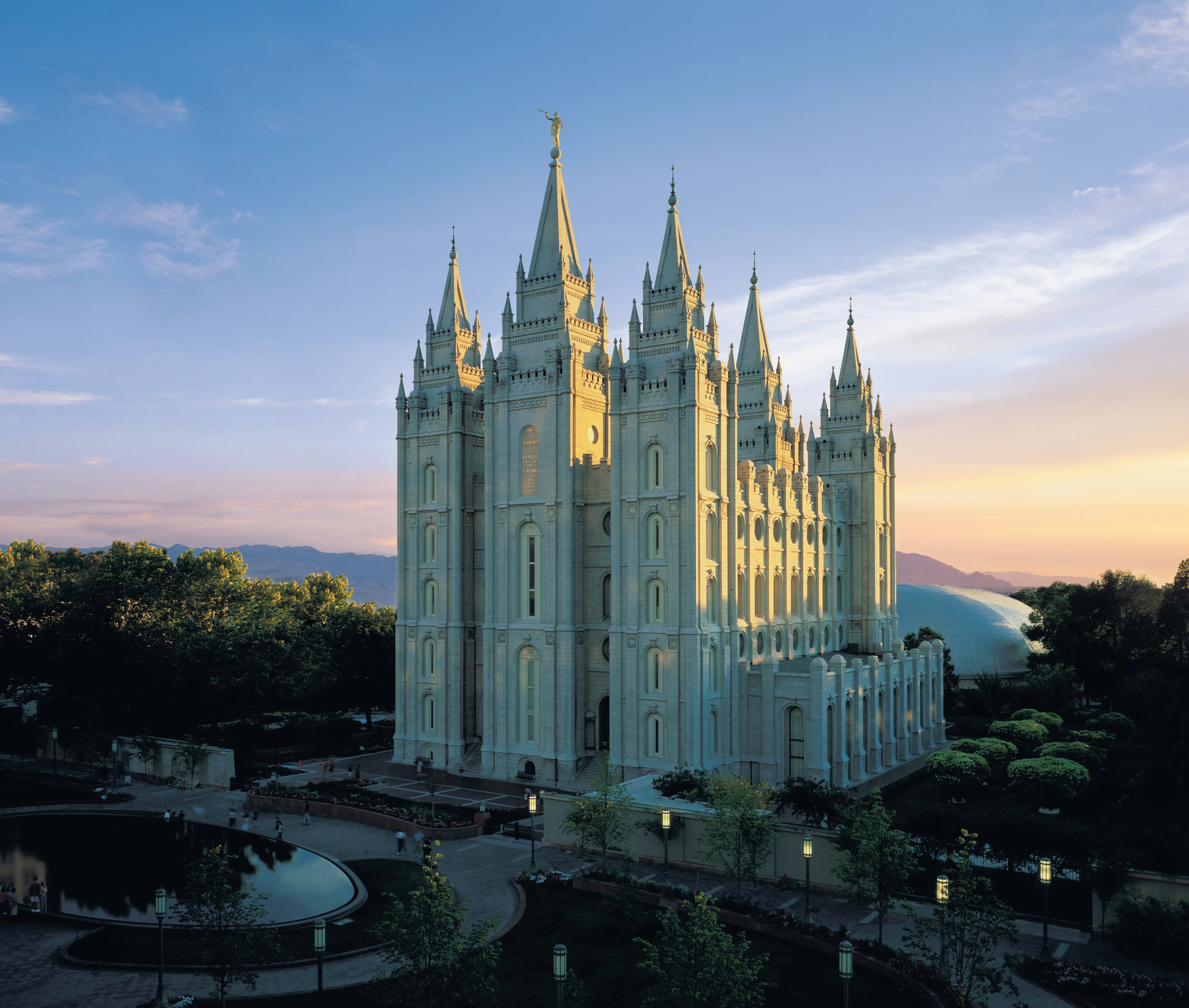 The Salt Lake Temple and a portion of Temple Square at sunset.