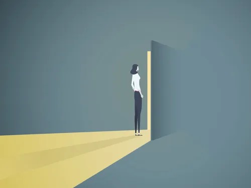 woman standing before open door