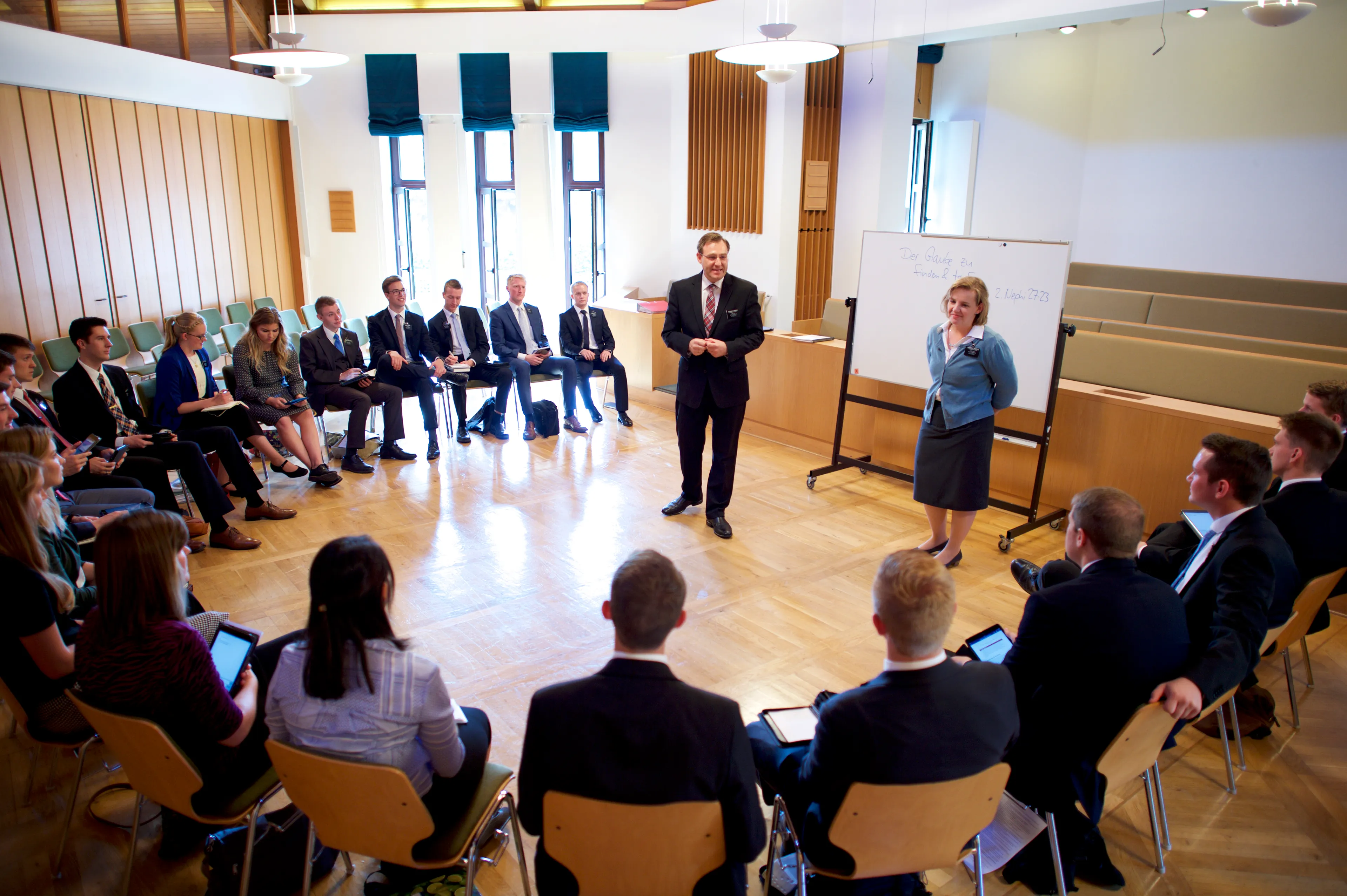 A group of missionaries in Germany participate in a zone conference.