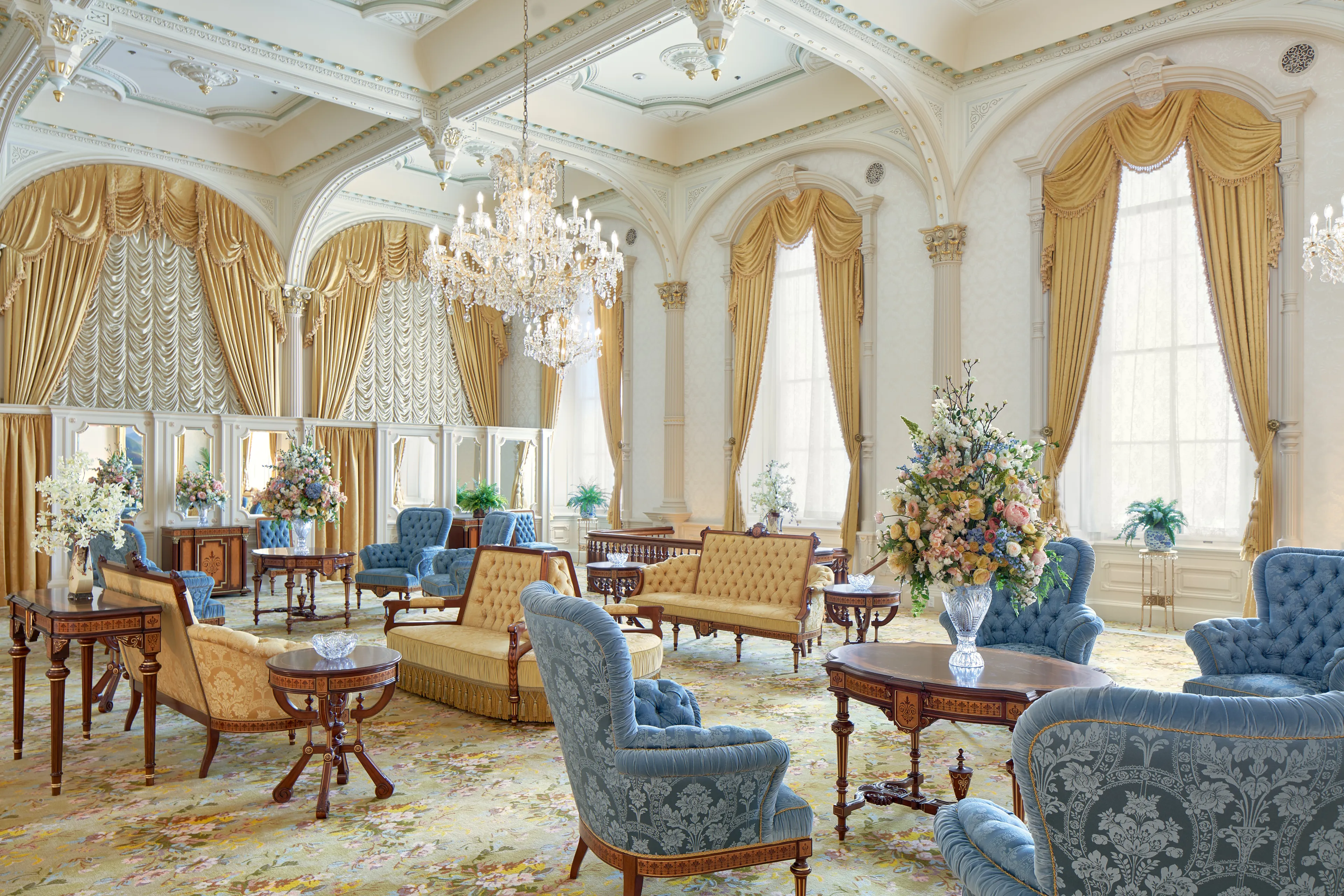 Interior image of the Manti Utah Temple. The image features the Celestial Room. There are chairs and couches throughout the room. A chandelier hangs from the center of the room.