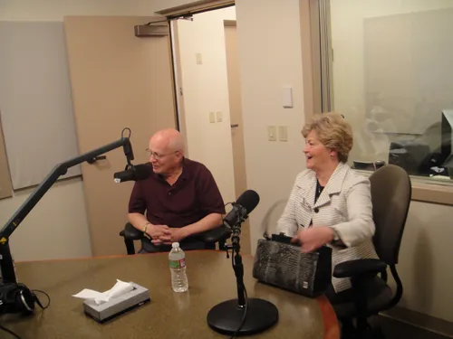 Screen capture from the program "Faith in Action."  Two people sitting at a table with microphones. Episode 20: Woodward Ghana.