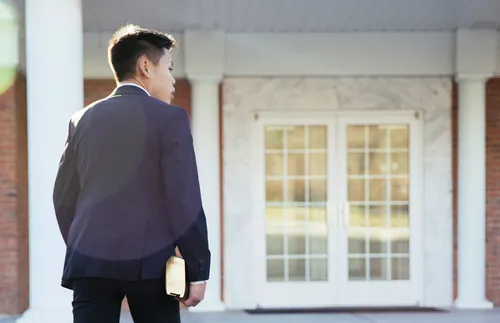 boy walking into church alone