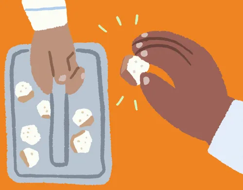 Hand taking bread from sacrament tray