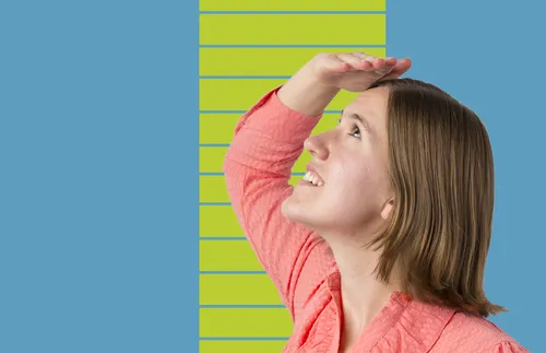 young adult woman with hand raised over head