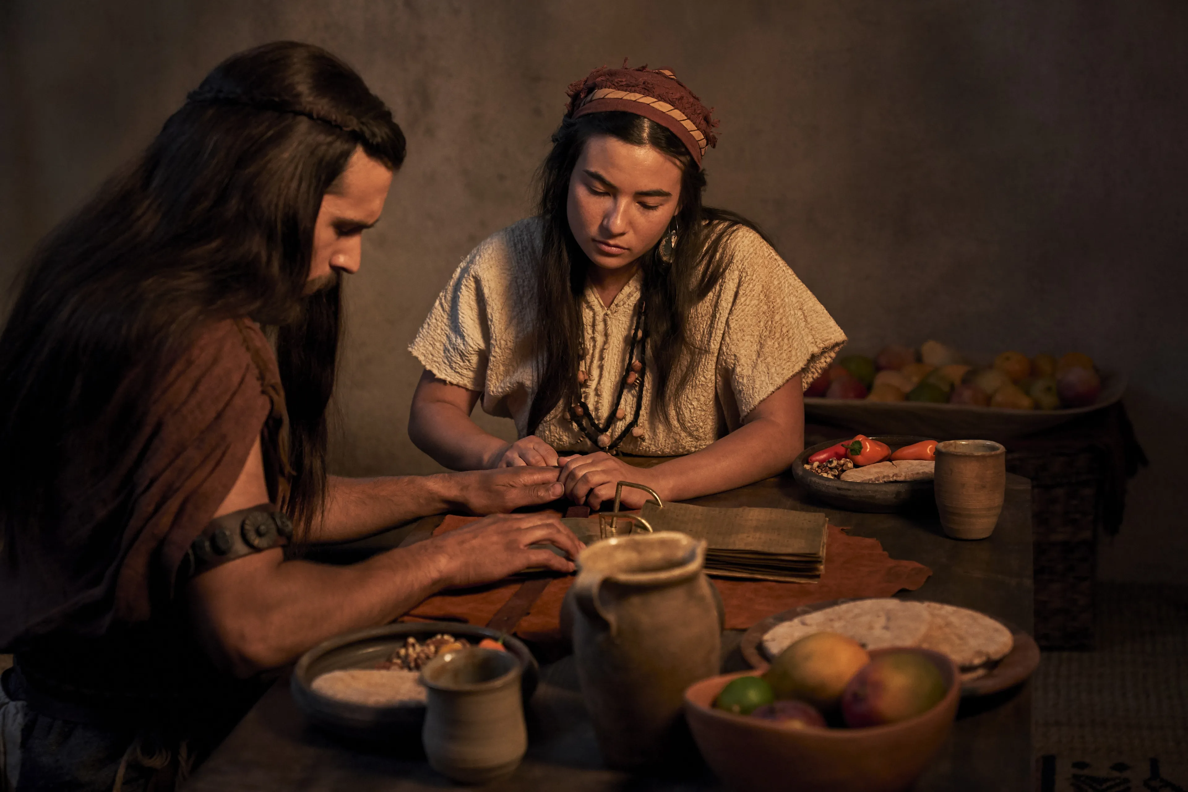 Enos and his wife study the plates.