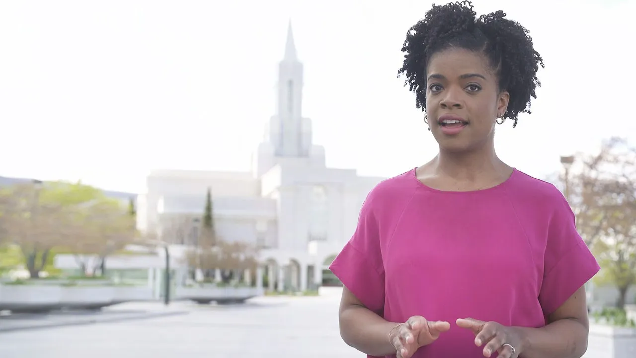 A woman stands outside a Temple and explains why people marry in temples