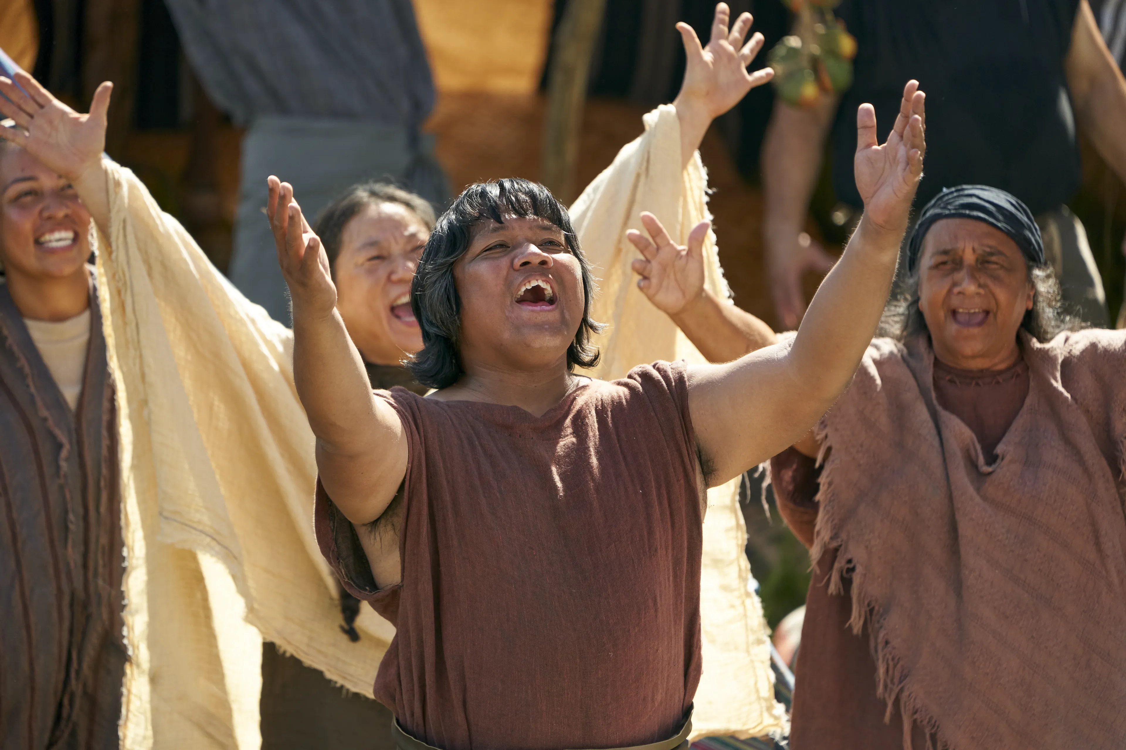 Men and women gather to listen to King Benjamin in the Land of Zarahemla.