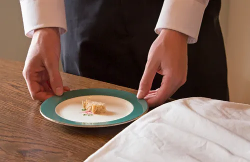 a man preparing the bread for a sacrament service at home