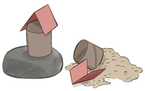 A bird feeder on a rock and knocked down.