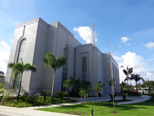 A back-view angle of the Manaus Brazil Temple in the daytime, including part of the grassy landscape.