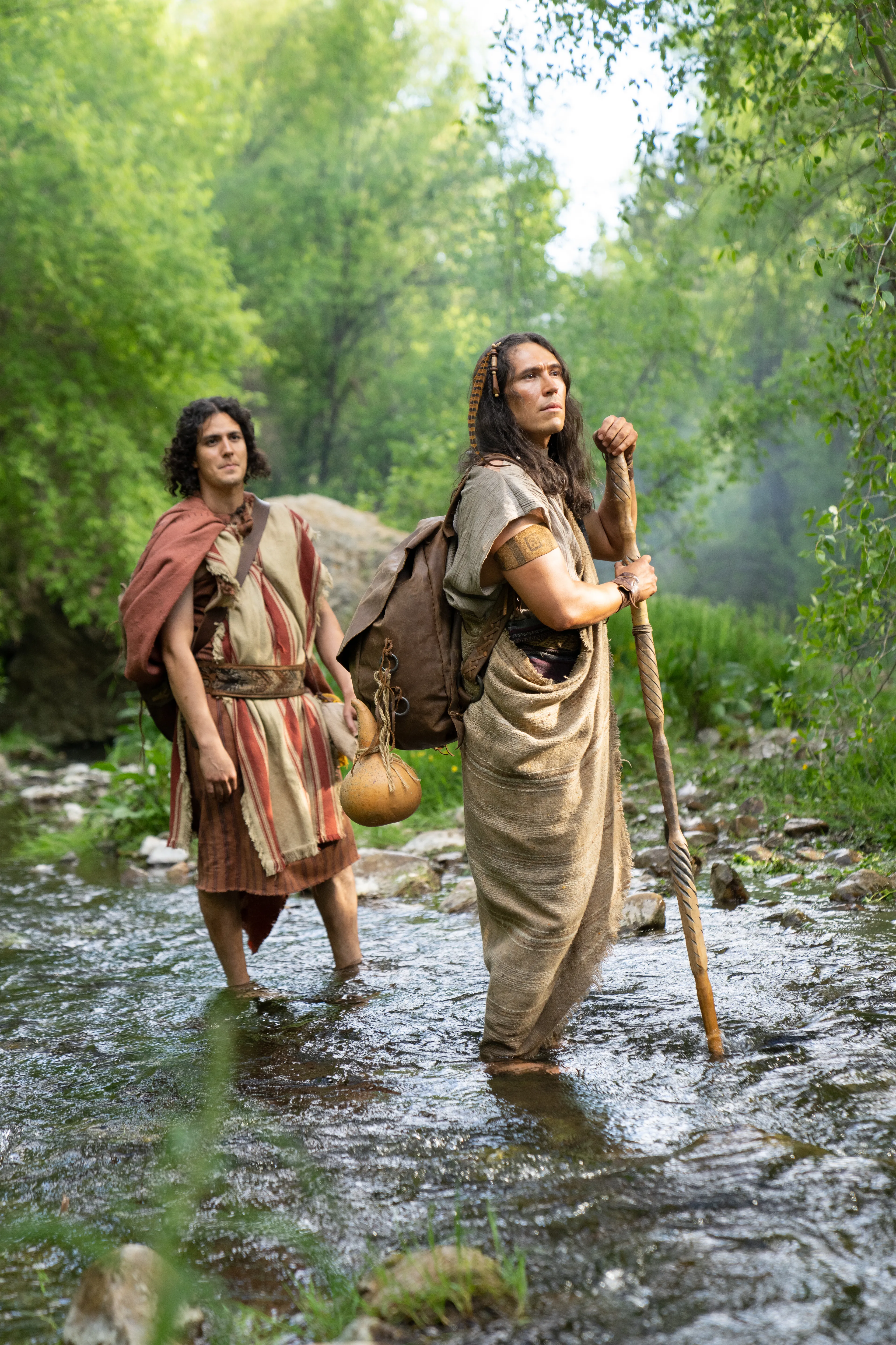 Ammon helps the people of Anti-Nephi-Lehi cross a river in the wilderness on their way to Zarahemla.