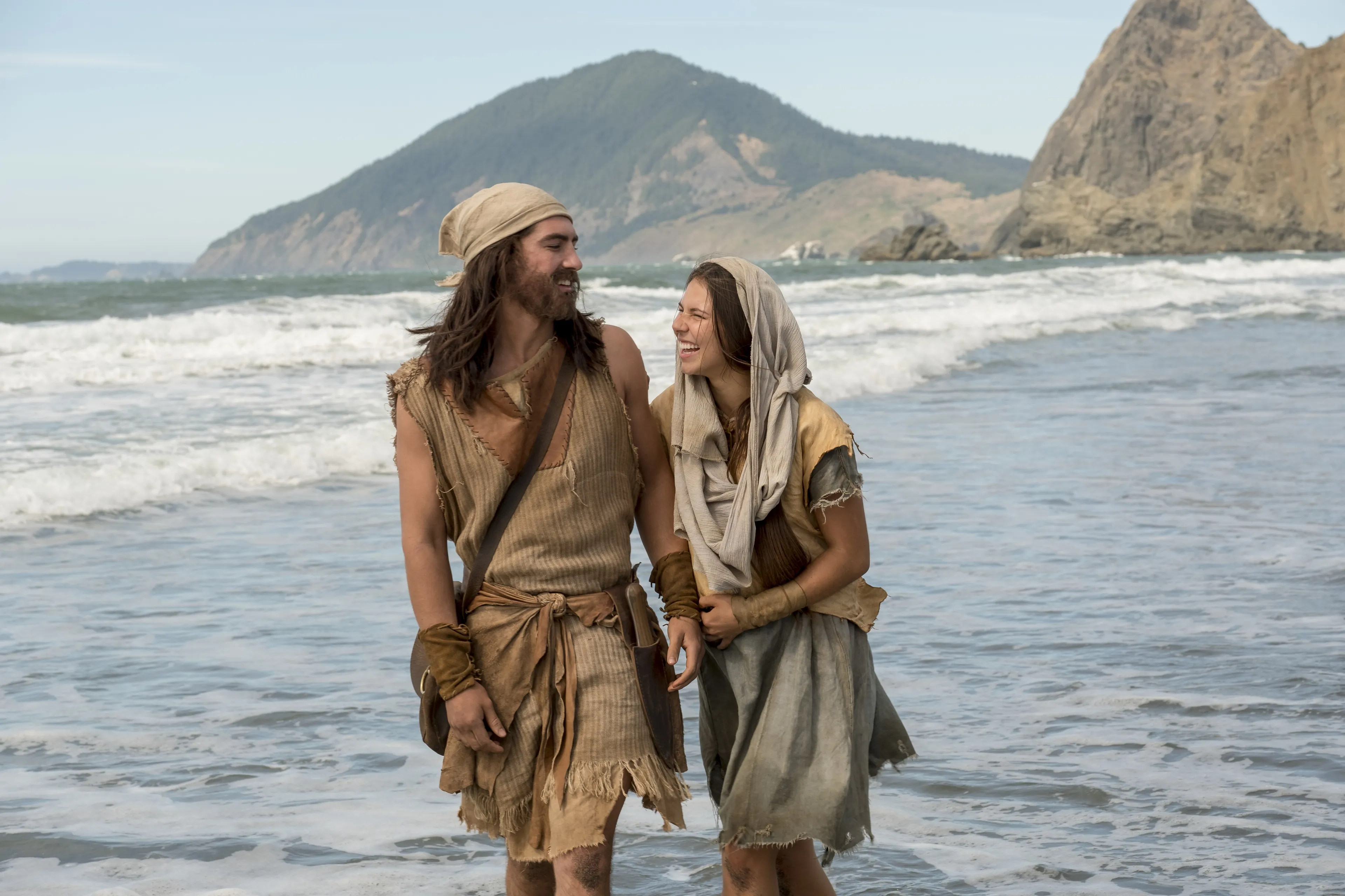 Nephi and his wife walk along the shore.