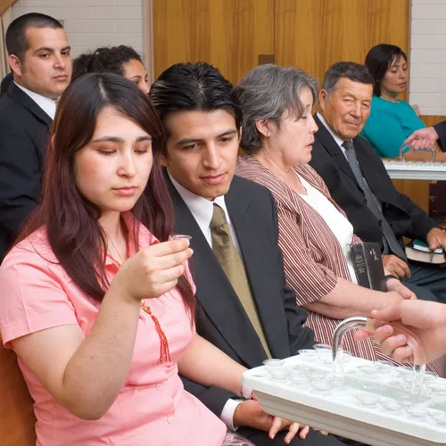 people partaking of the sacramental water