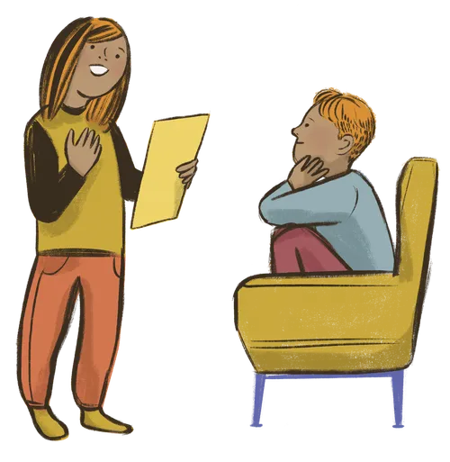 A girl reads something to a boy sitting on a couch.