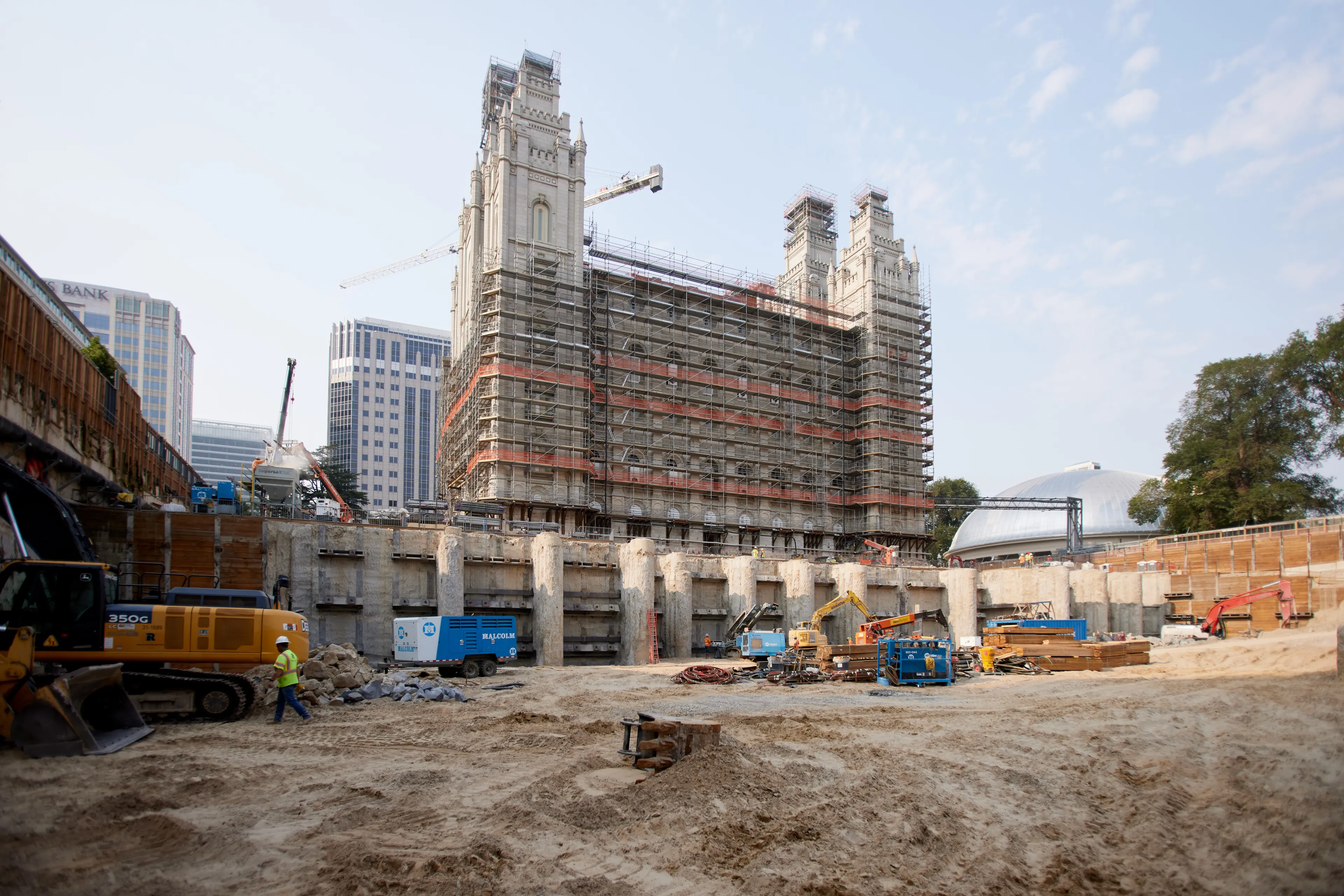 Excavation has reached 45 feet below street level on the Salt Lake Temple renovation project, exposing the buttresses of the secant wall made up of rows of interlocking concrete and steel columns, 85 feet deep, that shore up the temple foundation. Twenty more feet of soil will be removed before construction begins on the three-level underground north addition. The photo was taken in August 2021.