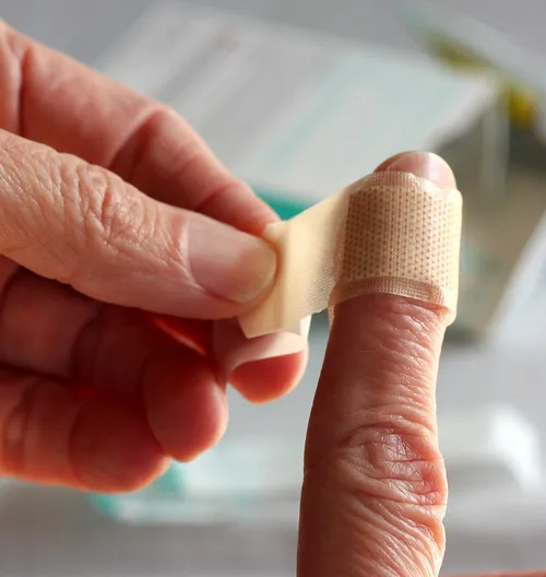 bandage being wrapped around finger