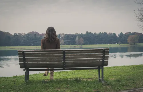 woman sitting on bench
