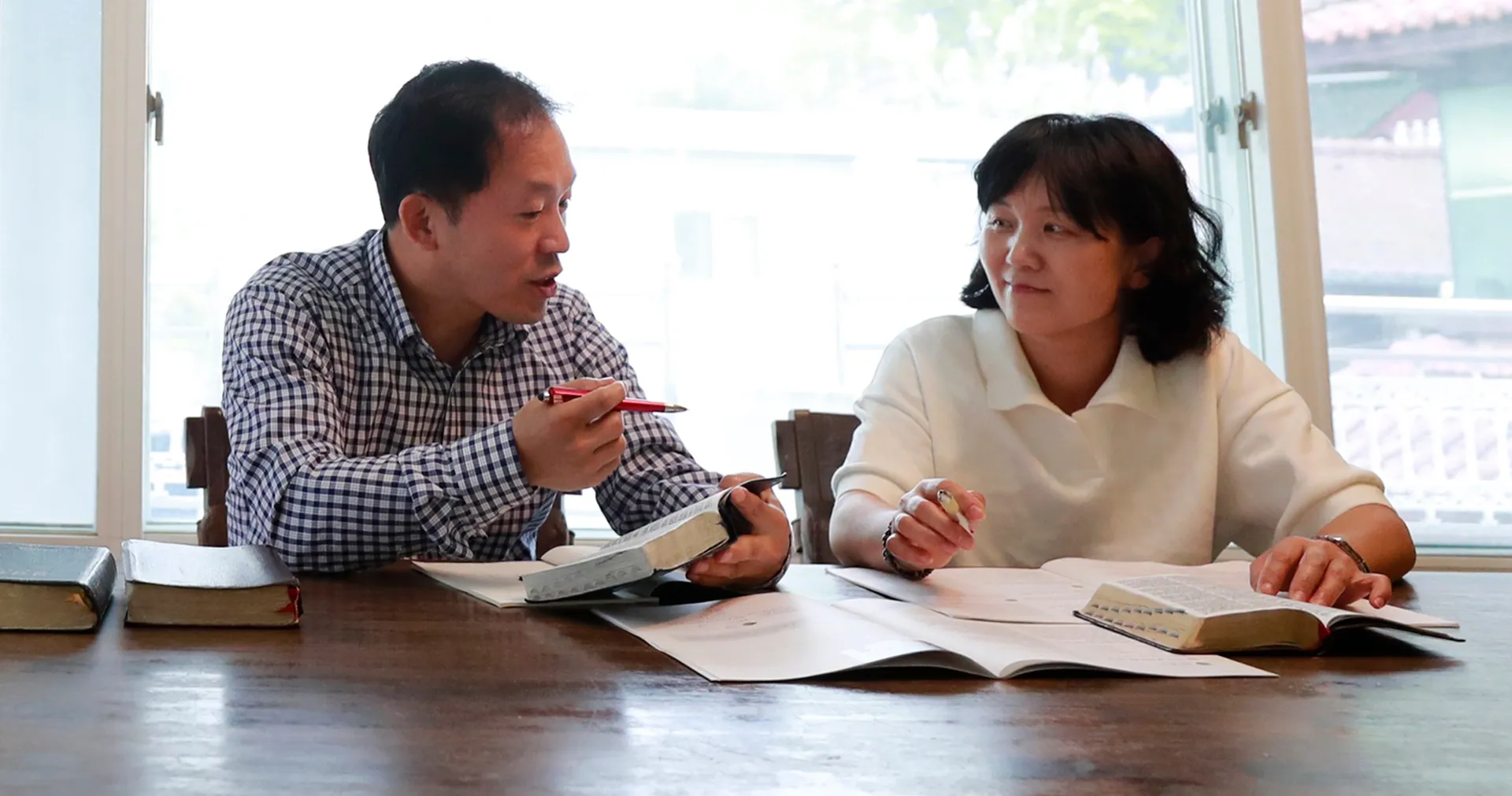 Man and woman talking at a table