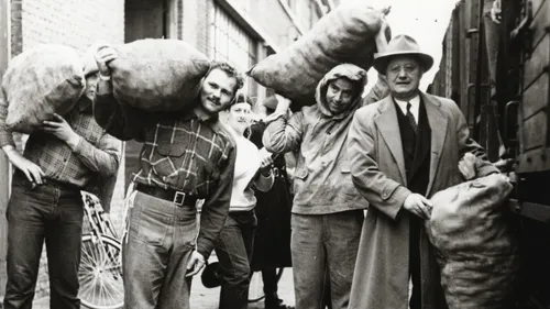 men carrying sacks of potatoes