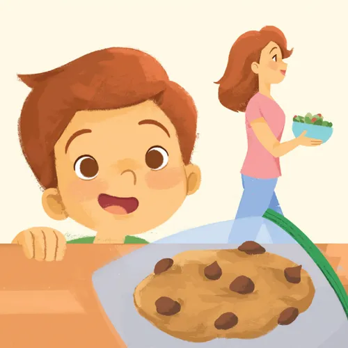 Boy looking at a cookie on a counter