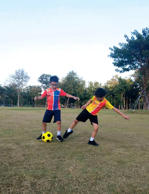 Two boys playing soccer